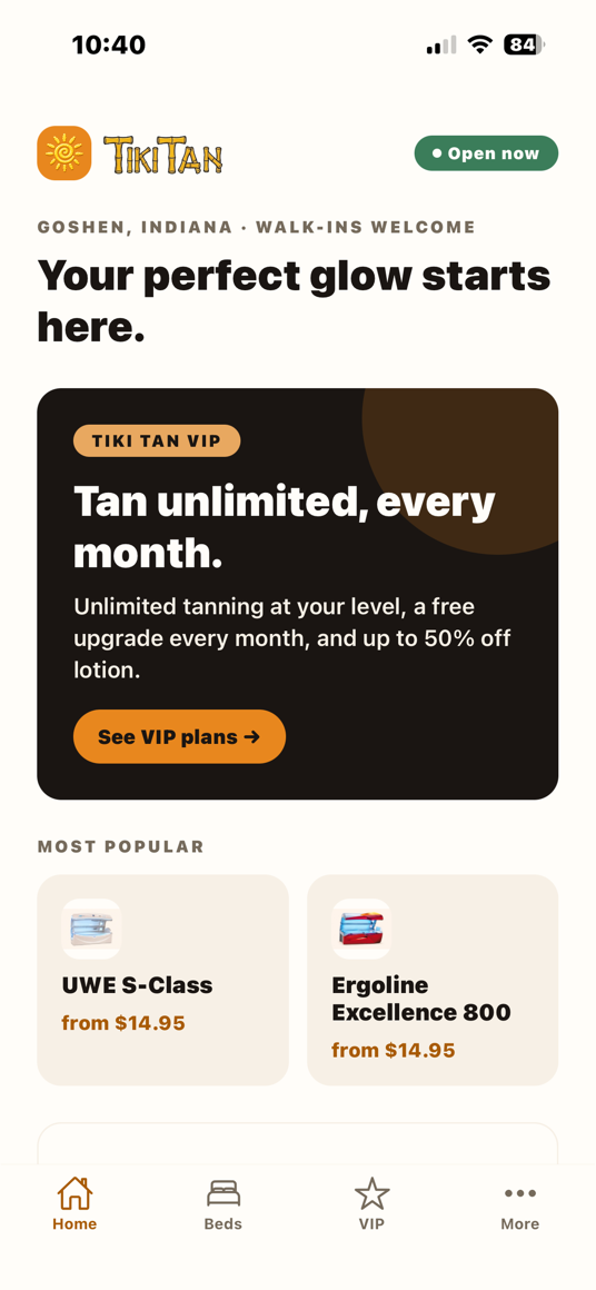 The Tiki Tan app home screen: the VIP membership card and the most popular beds